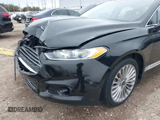 2014 Ford Fusion Titanium with VIN 3FA6P0K9XER364392, listed as a IAAI auction lot 41642439 with 130,302 mi miles and . Bid and sale history available at DreamBid. Image 17.