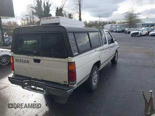 1997 Nissan Frontier XE with VIN 1N6SD16S1VC351353, listed as a IAAI auction lot 41623370 with 198,230 mi miles and . Bid and sale history available at DreamBid. Image 4.