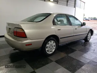 1997 Honda Accord LX with VIN JHMCD5630VC015585, listed as a Copart auction lot 52166155 with 121,820 mi miles and Salvage Title. Bid and sale history available at carsss.com. Image 3.