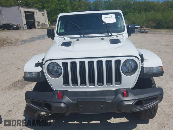 2021 Jeep Wrangler Unlimited Rubicon with VIN 1C4HJXFG5MW586842, listed as a IAAI auction lot 42186683 with 76,450 mi miles and . Bid and sale history available at DreamBid. Image 12.