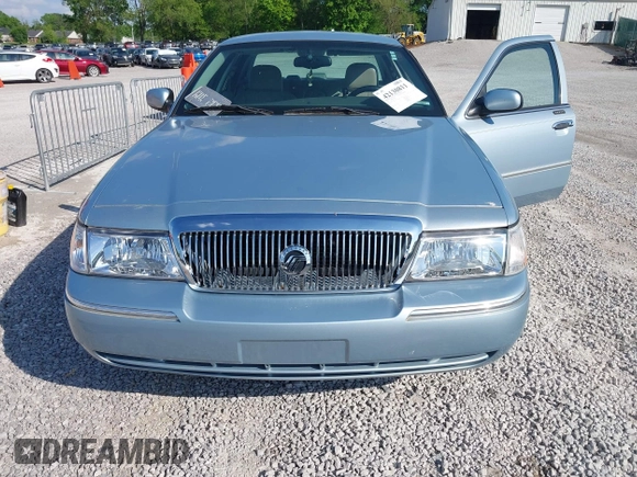 2005 Mercury Grand Marquis LS Premium z VIN 2MEFM75W15X621971, wystawiony jako IAAI lot #42130811 z przebiegiem 129 700 mil mil oraz . Historia ofert i sprzedaży dostępna na DreamBid. Obrazek 6.