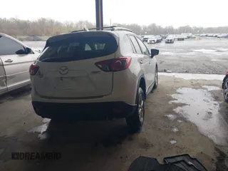 2014 Mazda CX-5 Touring with VIN JM3KE4CY9E0370610, listed as a IAAI auction lot 42016896 with 72,340 mi miles. Bid and sale history available at carsss.com. Image 4.