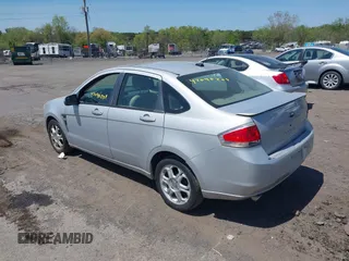 2008 Ford Focus SE with VIN 1FAHP35N88W271973, listed as a IAAI auction lot 42090204 with 261,457 mi miles. Bid and sale history available at carsss.com. Image 3.