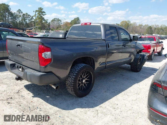 2014 Toyota Tundra 4WD Truck SR with VIN 5TFUM5F11EX055025, listed as a IAAI auction lot 41883017 with 100,565 mi miles. Bid and sale history available at carsss.com. Image 4.