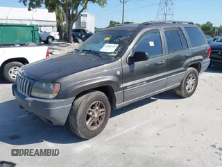2004 Jeep Grand Cherokee Laredo with VIN 1J4GW48S74C401022, listed as a IAAI auction lot 41982319 with 170,607 mi miles. Bid and sale history available at carsss.com. Image 2.