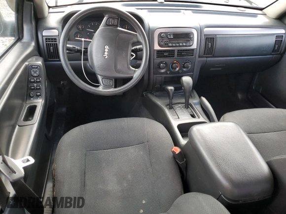 2004 Jeep Grand Cherokee Laredo with VIN 1J4GW48S84C184757, listed as a Copart auction lot 52895745 with 242,307 mi miles and Salvage Title. Bid and sale history available at carsss.com. Image 8.