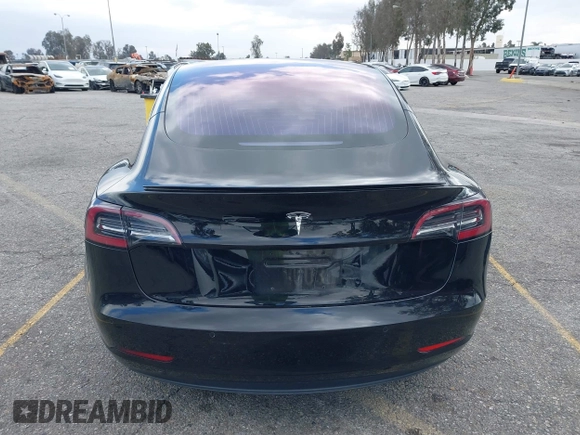 2018 Tesla Model 3 Long Range Battery with VIN 5YJ3E1EA9JF009384, listed as a IAAI auction lot 41544624 with 66,896 mi miles and . Bid and sale history available at DreamBid. Image 16.