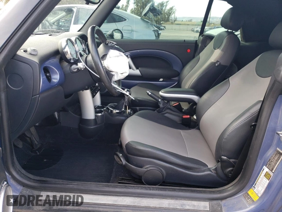 2007 MINI Convertible with VIN WMWRF33537TF66807, listed as a Copart auction lot 43664845 with 91,079 mi miles and Salvage Title. Bid and sale history available at DreamBid. Image 7.