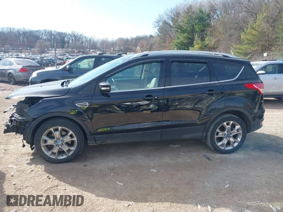 2016 Ford Escape Titanium with VIN 1FMCU9JX4GUB38303, listed as a IAAI auction lot 41788421 with 138,511 mi miles and . Bid and sale history available at DreamBid. Image 15.