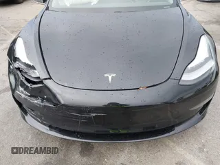 2019 Tesla Model 3 Mid Range with VIN 5YJ3E1EA6KF361808, listed as a IAAI auction lot 41767241 with 96,200 mi miles and . Bid and sale history available at carsss.com. Image 10.