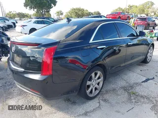 2014 Cadillac ATS Standard RWD z VIN 1G6AA5RA6E0146052, wystawiony jako IAAI lot #40220255 z przebiegiem 128 569 mil mil oraz . Historia ofert i sprzedaży dostępna na DreamBid. Obrazek 4.