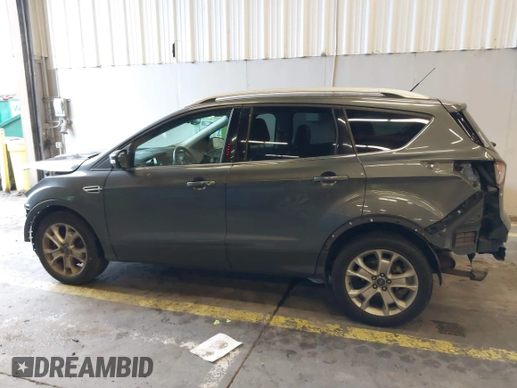 2016 Ford Escape Titanium with VIN 1FMCU9J92GUB63525, listed as a IAAI auction lot 41469824 with 156,773 mi miles. Bid and sale history available at carsss.com. Image 14.