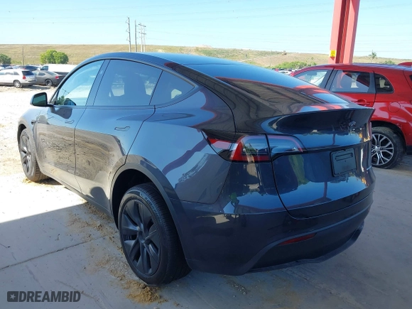 2025 Tesla Model Y Long Range with VIN 7SAYGDEE3SA367750, listed as a IAAI auction lot 41933682 with 1,127 mi miles. Bid and sale history available at carsss.com. Image 3.