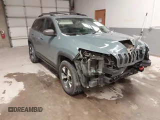 2015 Jeep Cherokee Trailhawk with VIN 1C4PJMBS6FW724931, listed as a IAAI auction lot 41602181 with 153,340 mi miles and . Bid and sale history available at carsss.com. Image 1.