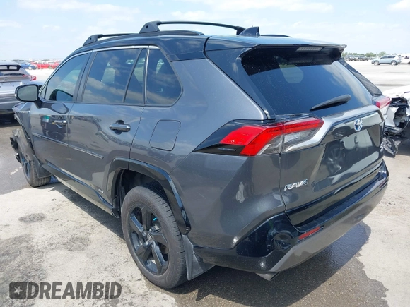 2021 Toyota RAV4 Hybrid XSE with VIN 2T3E6RFV8MW026973, listed as a IAAI auction lot 42052289 with 94,857 mi miles and . Bid and sale history available at DreamBid. Image 3.