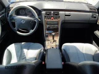 2000 Mercedes-Benz E with VIN WDBJF74J7YB055624, listed as a Copart auction lot 63880184 with 71,355 mi miles and Salvage Title. Bid and sale history available at DreamBid. Image 8.