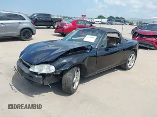 2002 Mazda MX-5 Miata Cloth with VIN JM1NB353520221312, listed as a IAAI auction lot 42410028 with 99,375 mi miles and . Bid and sale history available at DreamBid. Image 2.