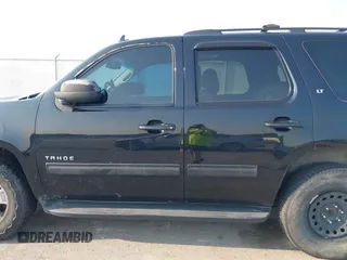 2014 Chevrolet Tahoe LT with VIN 1GNSCBE01ER235571, listed as a IAAI auction lot 42403118 with 238,069 mi miles and . Bid and sale history available at DreamBid. Image 14.