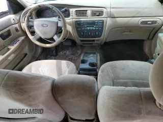 2004 Ford Taurus SE z VIN 1FAFP53U44A122559, wystawiony jako Copart lot #55606595 z przebiegiem Nie podano mil oraz Szkoda całkowita • Salvage title. Historia ofert i sprzedaży dostępna na DreamBid. Obrazek 8.