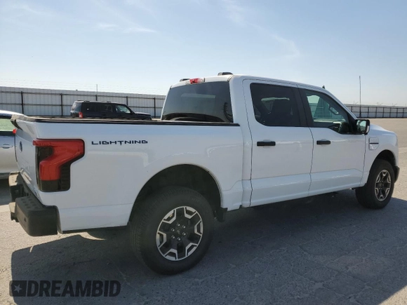 2023 Ford F-150 Lightning Pro with VIN 1FT6W1EVXPWG44972, listed as a Copart auction lot 60303485 with 19,788 mi miles and Salvage title. Bid and sale history available at DreamBid. Image 3.