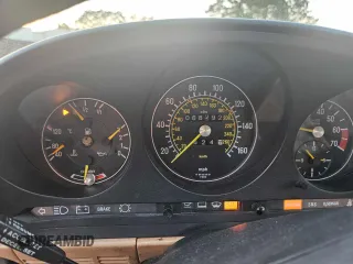 1987 Mercedes-Benz 560 with VIN WDBBA48D5HA061899, listed as a Copart auction lot 76554184 with 68,292 mi miles and Salvage Title. Bid and sale history available at carsss.com. Image 8.