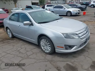 2010 Ford Fusion Hybrid z VIN 3FADP0L38AR296069, wystawiony jako IAAI lot #42760565 z przebiegiem 94 994 mil mil oraz . Historia ofert i sprzedaży dostępna na DreamBid. Obrazek 1.