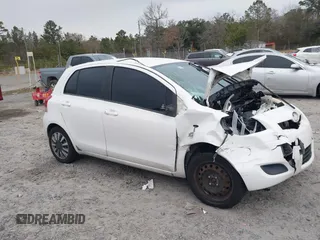 2009 Toyota Yaris with VIN JTDKT903595236903, listed as a IAAI auction lot 41309108 with 140,624 mi miles. Bid and sale history available at carsss.com. Image 1.