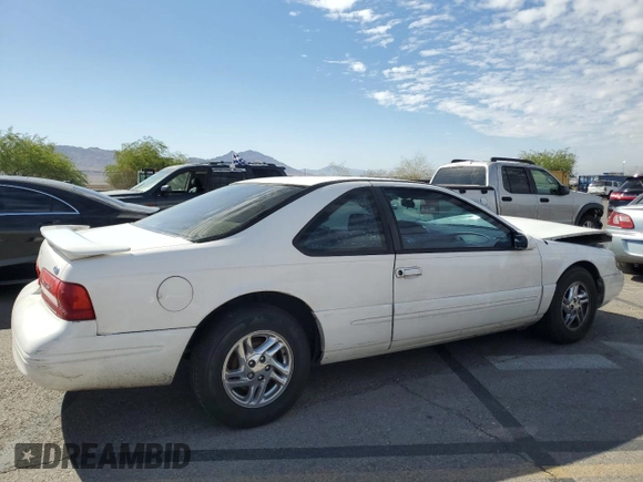 1996 Ford Thunderbird LX z VIN 1FALP62W7TH119284, wystawiony jako Copart lot #71701084 z przebiegiem 239 462 mil mil oraz Szkoda całkowita • Salvage title. Historia ofert i sprzedaży dostępna na DreamBid. Obrazek 3.