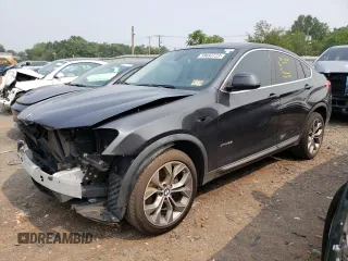 2015 BMW X4 xDrive28i with VIN 5UXXW3C55F0M87998, listed as a Copart auction lot 59693723 with 73,846 mi miles. Bid and sale history available at carsss.com. Image 1.