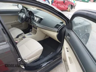 2015 Mitsubishi Lancer SE with VIN JA32V2FW2FU002303, listed as a IAAI auction lot 41927592 with 32,444 mi miles. Bid and sale history available at carsss.com. Image 5.
