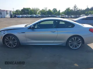 2013 BMW 6 Series 650i z VIN WBAYM9C57DDW20410, wystawiony jako IAAI lot #42348010 z przebiegiem 146 985 mil mil oraz . Historia ofert i sprzedaży dostępna na DreamBid. Obrazek 14.