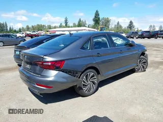 2021 Volkswagen Jetta SEL with VIN 3VWE57BU9MM098736, listed as a IAAI auction lot 42384031 with 28,070 mi miles and . Bid and sale history available at DreamBid. Image 4.