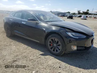 2019 Tesla Model S 100D with VIN 5YJSA1E42KF331240, listed as a Copart auction lot 54713975 with 43,940 mi miles and Salvage title. Bid and sale history available at DreamBid. Image 4.
