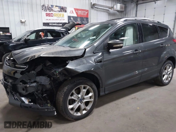 2016 Ford Escape Titanium with VIN 1FMCU9J90GUB35593, listed as a IAAI auction lot 42309020 with 173,019 mi miles and . Bid and sale history available at DreamBid. Image 17.