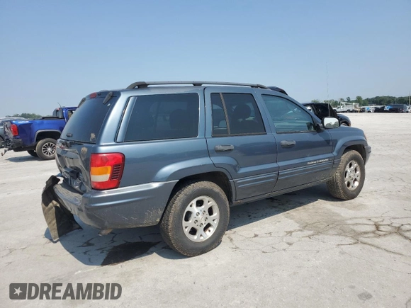 2002 Jeep Grand Cherokee Laredo with VIN 1J4GW48S92C319161, listed as a Copart auction lot 59304035 with 257,907 mi miles and Salvage title. Bid and sale history available at DreamBid. Image 3.