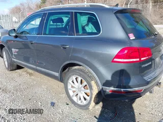 2016 Volkswagen Touareg Sport with VIN WVGEF9BP2GD005315, listed as a IAAI auction lot 41588590 with 134,709 mi miles and . Bid and sale history available at DreamBid. Image 3.