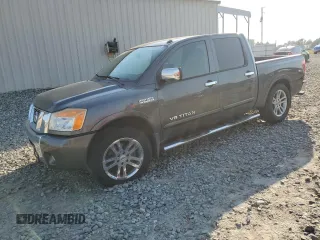 2012 Nissan Titan SV with VIN 1N6AA0ED3CN330068, listed as a Copart auction lot 47001125 with 221,557 mi miles and Salvage title. Bid and sale history available at DreamBid. Image 1.
