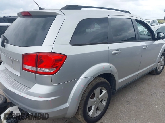 2013 Dodge Journey SE z VIN 3C4PDCAB9DT529668, wystawiony jako IAAI lot #42130654 z przebiegiem 156 472 mil mil oraz . Historia ofert i sprzedaży dostępna na DreamBid. Obrazek 4.