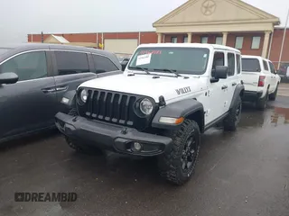 2023 Jeep Wrangler Sport with VIN 1C4HJXDN8PW523532, listed as a IAAI auction lot 41962483 with 14,643 mi miles and . Bid and sale history available at DreamBid. Image 2.