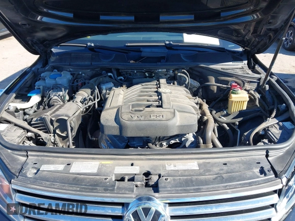 2016 Volkswagen Touareg Sport with VIN WVGEF9BP4GD012265, listed as a IAAI auction lot 41208383 with 69,205 mi miles and . Bid and sale history available at DreamBid. Image 10.