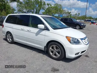 2008 Honda Odyssey Touring with VIN 5FNRL38858B006304, listed as a IAAI auction lot 41814309 with 208,778 mi miles. Bid and sale history available at carsss.com. Image 1.