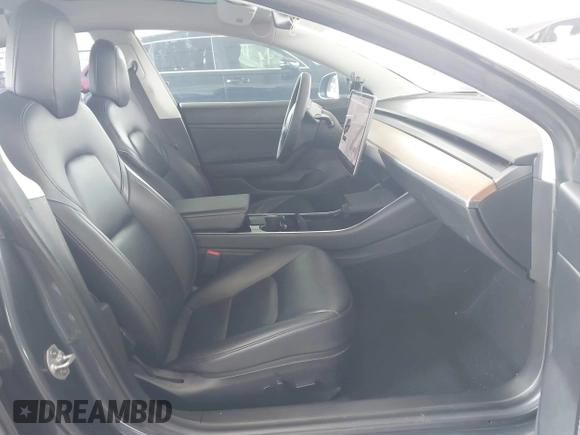 2020 Tesla Model 3 Standard Range Plus with VIN 5YJ3E1EA8LF743405, listed as a IAAI auction lot 41923592 with 81,901 mi miles. Bid and sale history available at carsss.com. Image 5.