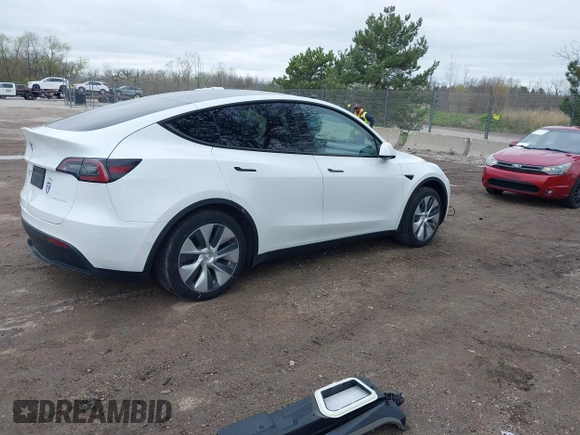2022 Tesla Model Y Long Range with VIN 7SAYGDEE1NF421098, listed as a IAAI auction lot 42177555 with 55,855 mi miles and . Bid and sale history available at carsss.com. Image 4.