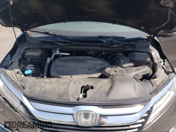 2019 Honda Odyssey Touring z VIN 5FNRL6H87KB098010, wystawiony jako Copart lot #54791505 z przebiegiem 94 477 mil mil oraz Szkoda całkowita • Salvage title. Historia ofert i sprzedaży dostępna na DreamBid. Obrazek 12.
