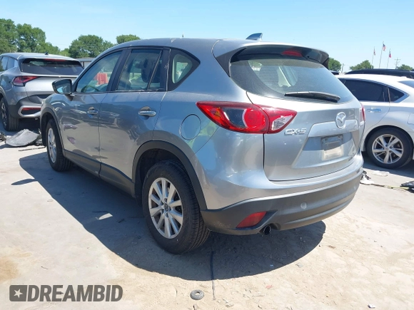 2014 Mazda CX-5 Sport with VIN JM3KE2BE7E0371203, listed as a IAAI auction lot 42243756 with 121,534 mi miles and . Bid and sale history available at DreamBid. Image 3.