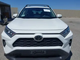 2019 Toyota RAV4 XLE with VIN JTMW1RFV9KD003246, listed as a IAAI auction lot 42115291 with 81,910 mi miles. Bid and sale history available at carsss.com. Image 13.