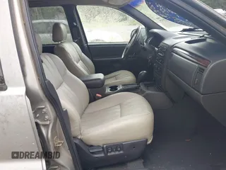 2000 Jeep Grand Cherokee Laredo z VIN 1J4G248N2YC334566, wystawiony jako IAAI lot #42623519 z przebiegiem Nie podano mil oraz . Historia ofert i sprzedaży dostępna na DreamBid. Obrazek 5.