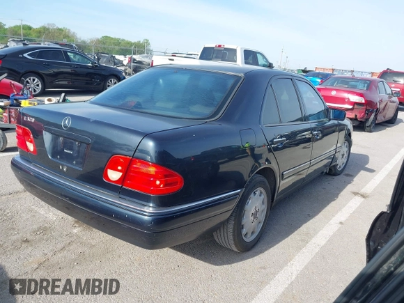 1997 Mercedes-Benz E-Class with VIN WDBJF55F7VJ027080, listed as a IAAI auction lot 42120838 with 150,197 mi miles. Bid and sale history available at carsss.com. Image 4.