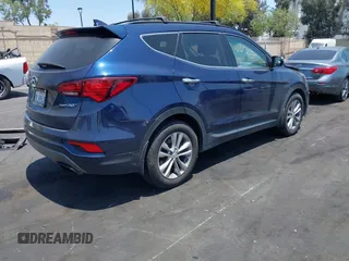 2018 Hyundai Santa Fe 2.0T z VIN 5XYZU4LA8JG537427, wystawiony jako IAAI lot #42349692 z przebiegiem 148 764 mil mil oraz . Historia ofert i sprzedaży dostępna na DreamBid. Obrazek 4.