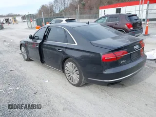 2015 Audi A8 L 4.0T with VIN WAU32AFD7FN006233, listed as a IAAI auction lot 41353034 with 119,693 mi miles. Bid and sale history available at carsss.com. Image 3.